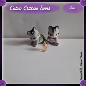 Fisher Cat Twins With Baby Bottle